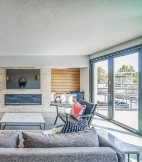 a living room filled with furniture and a large chandelier