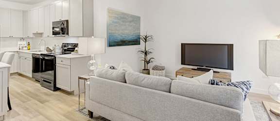 Living Room With Kitchen View at Winfield Station Apartments, J Street Property Services, Winfield, Illinois