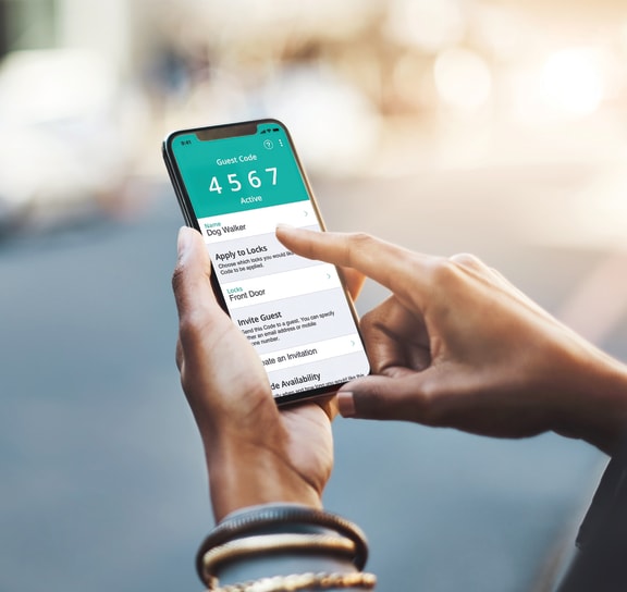 a person holding a smartphone with the uber app on the screenat Thornridge Apartments, Grand Blanc, Michigan