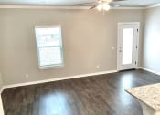 Thumbnail 8 of 60 - 03 B1 (1-car) open concept living and dining with laminate wood flooring
