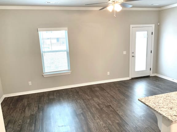 03 B1 (1-car) open concept living and dining with laminate wood flooring