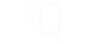 A black background with a white letter Q and the words "The Q" above it.