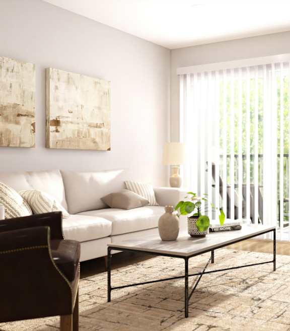 A living room with a white couch, a coffee table, and a painting on the wall.