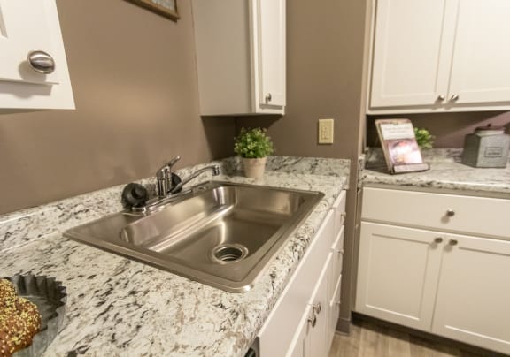 This is a photo of the kitchen of a 1245 square foot 2 bedroom apartment at Aspen Village, Cincinnati, OH
