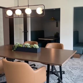 a conference room with a wooden table and chairs