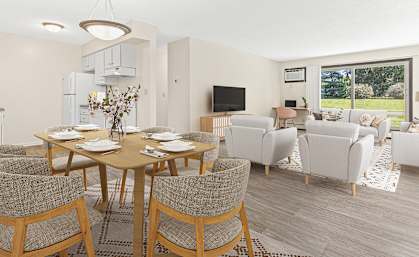 a living room and dining room with a table and chairs