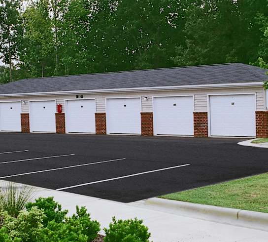 A building with a parking lot in front of it.