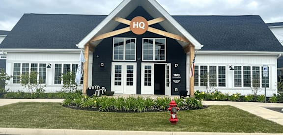 a home with a fire hydrant in front of it