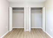 Thumbnail 7 of 18 - an empty bedroom with two closets at Lakeside @ Biscayne Gardens,North Miami, FL,33181