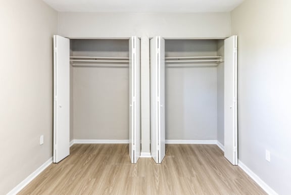an empty bedroom with two closets at Lakeside @ Biscayne Gardens,North Miami, FL,33181