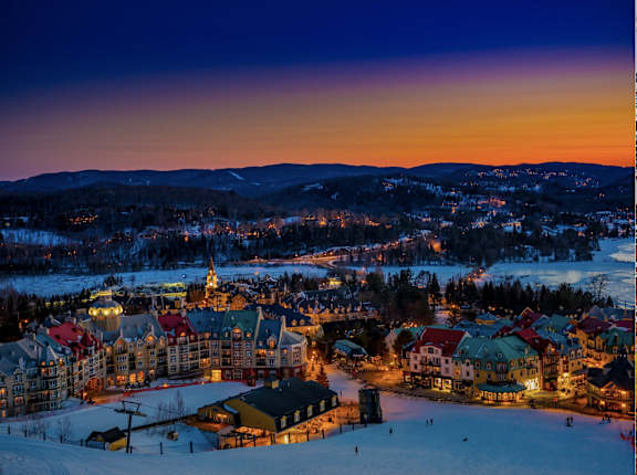 a city at sunset in the snow