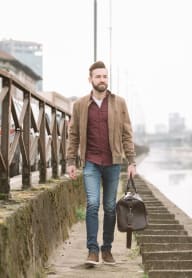 a man walking down a bridge carrying a brief case at Gage On Sixth, Washington, 98406