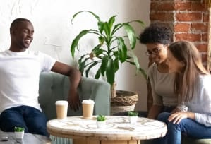 a group of people sitting on a couch in a living room
