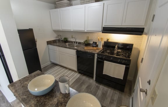 This is a photo of the kitchen in the 740 square foot 1 bedroom model apartment at Compton Lake Apartments in Mt. Healthy, OH.
