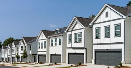 A row of modern houses with garages.