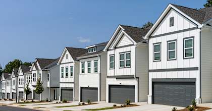 A row of modern houses with garages.