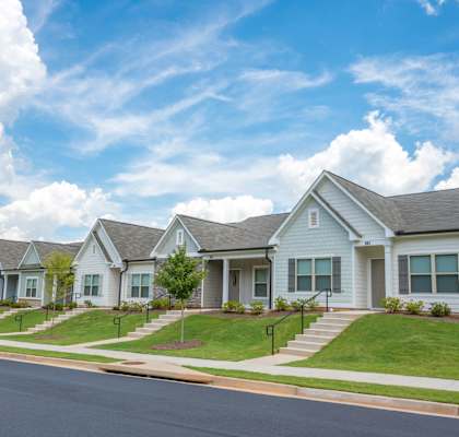 a row of houses on the side of a street
