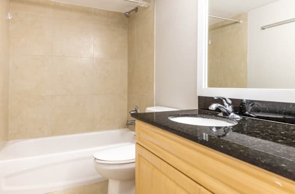 a bathroom with a sink toilet and bathtub at Lakeside @ Biscayne Gardens,North Miami, FL,33181