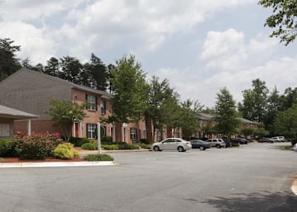 a street view of a building with cars parked in front of it  at Brookside Pointe, Travelers Rest, SC 29690