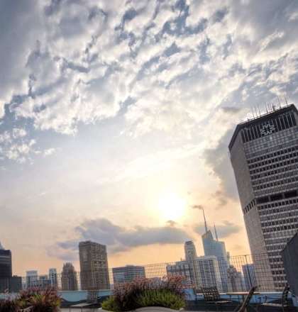 A tall building with a pointed top is the focal point of the image.