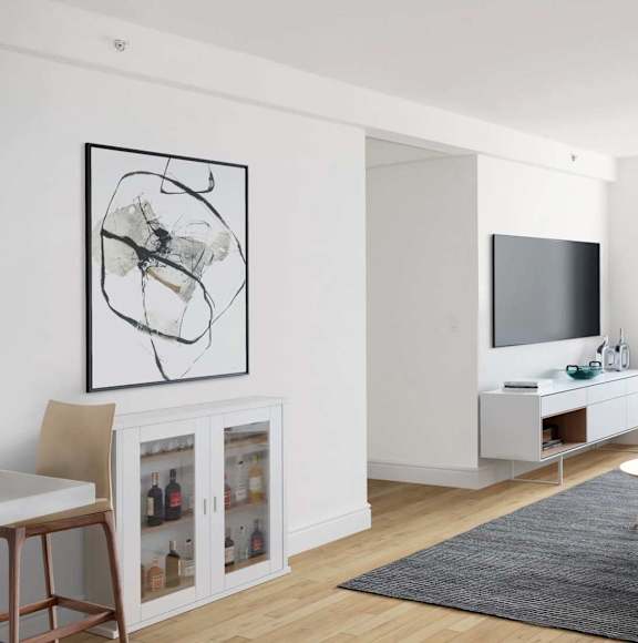 A modern living room with a large abstract painting on the wall. at The Metropolis, New York