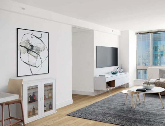 A modern living room with a large abstract painting on the wall.