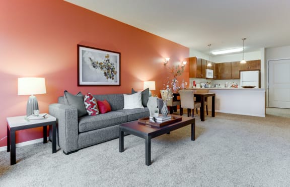 a living room with a couch and a table at The Legends at Silver Lake Village 55+ Apartments, St. Anthony, Minnesota