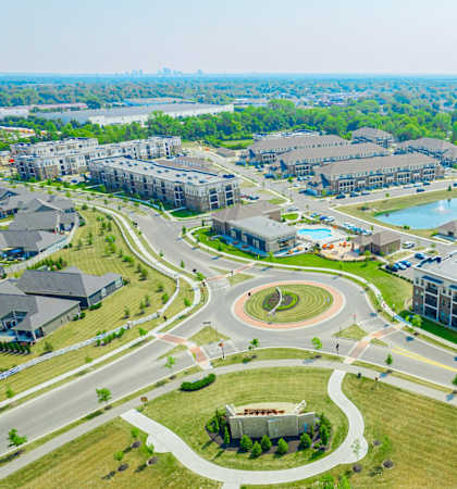 an aerial view of a city with buildings and roads