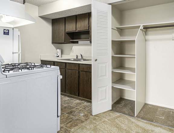 a kitchen with a white appliances at Normandy Village Apartments, Michigan City, IN 46360
