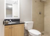 Thumbnail 9 of 18 - a bathroom with a toilet sink and shower at Lakeside @ Biscayne Gardens,North Miami, FL,33181