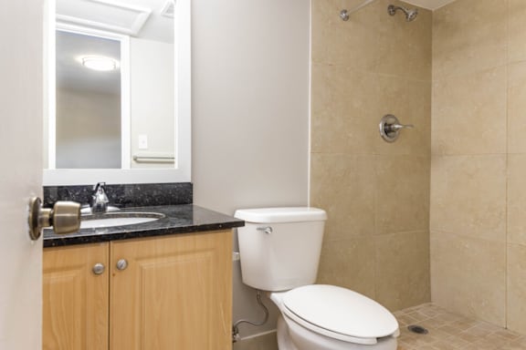 a bathroom with a toilet sink and shower at Lakeside @ Biscayne Gardens,North Miami, FL,33181