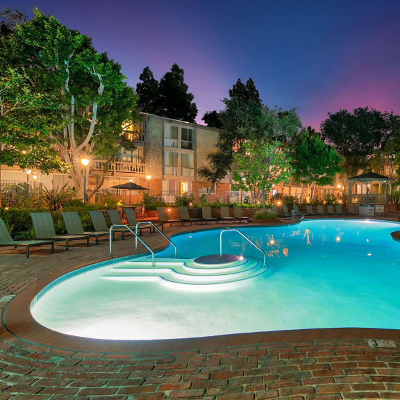 a swimming pool at night at The Meadows Apartments, Culver City , CA 90230