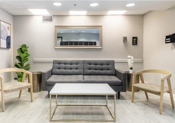 a living room with a couch and a coffee table at Lakeside @ Biscayne Gardens,North Miami, FL,33181