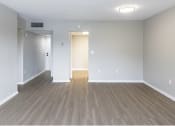 Thumbnail 5 of 18 - an empty living room with wood floors and white walls at Lakeside @ Biscayne Gardens,North Miami, FL,33181