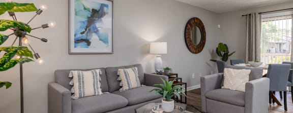 a living room with a couch and a chair and a table at Glen Hollow, Decatur