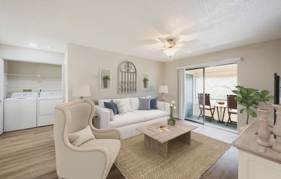 a living room with a white couch and a coffee tableat Lakeside Gardens, Daytona, 32114