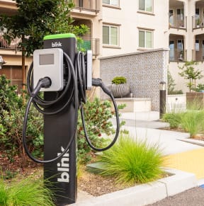 an ev charger and exterior of los alamitos building