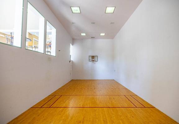 A room with wooden floors and white walls.
