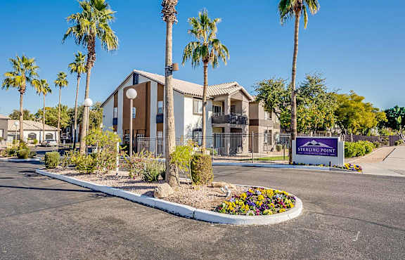 Sterling Point is a residential complex with a front sign and palm trees at Sterling Point Apartment Homes, Phoenix, AZ, 85042