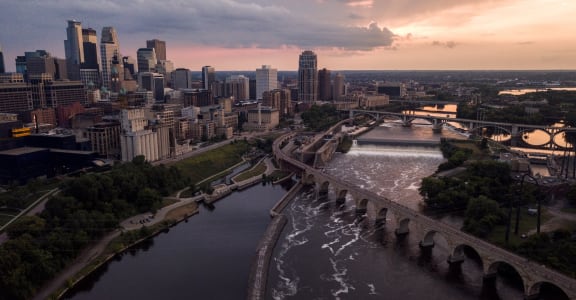 an aerial view of the city of minneapolis at sunset