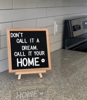 a sign that says don't call it a dream call it your home