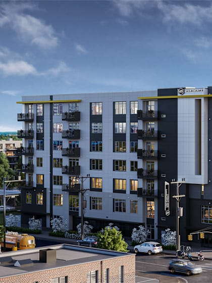a rendering of an apartment building on a city street  at Link Apartments® Mint Street, Charlotte, North Carolina
