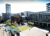 Thumbnail 1 of 3 - a view of a park and buildings in a city