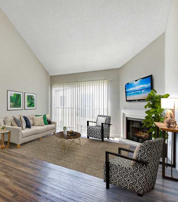 a living room with a spiral staircase and a couch and a table
