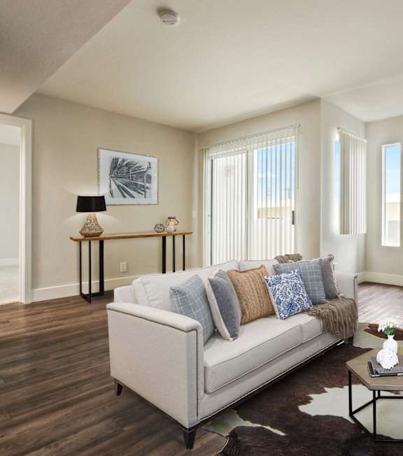 a living room with a fireplace and couch at Alon Apartments, Los Angeles, CA