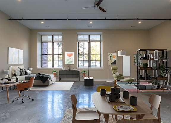 Expansive studios with tall ceilings and polished floors.