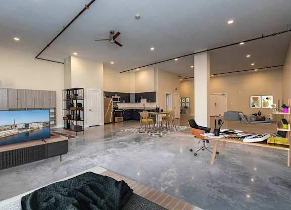 WM242 Studio with tall ceilings, polished concrete floors, large kitchens, stainles appliances.