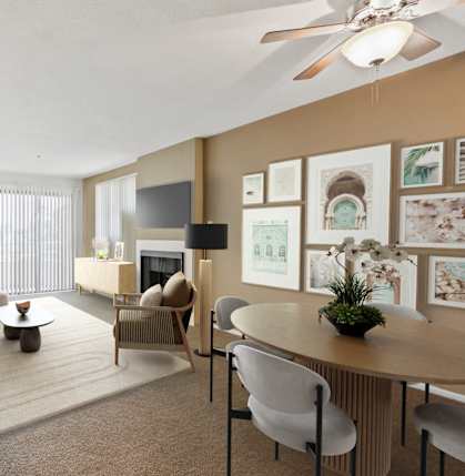 A living room with a couch, chairs, and a coffee table.