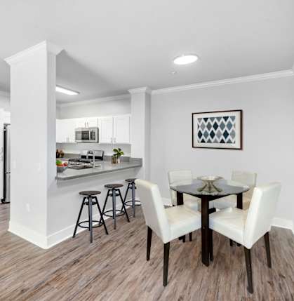 Dining area with a table and breakfast bar at Canyon Crest, Riverside, CA