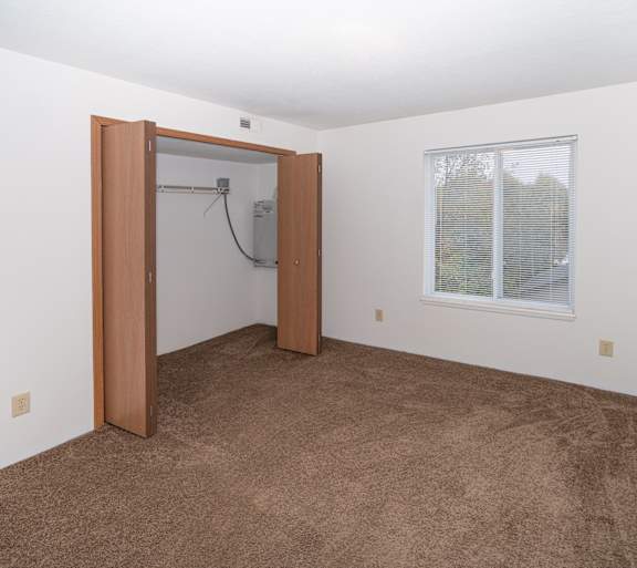 a living room with a couch and a table and a television